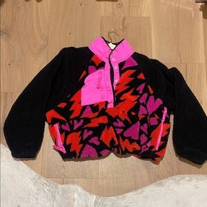 Free People Movement. Black and Pink Fleece Pullover with Geometric Pattern